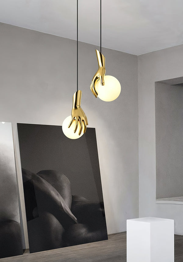 Avnorira Hand Holding Globe Brass Glass Pendant Light